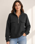Model wearing black half-zip pullover - front