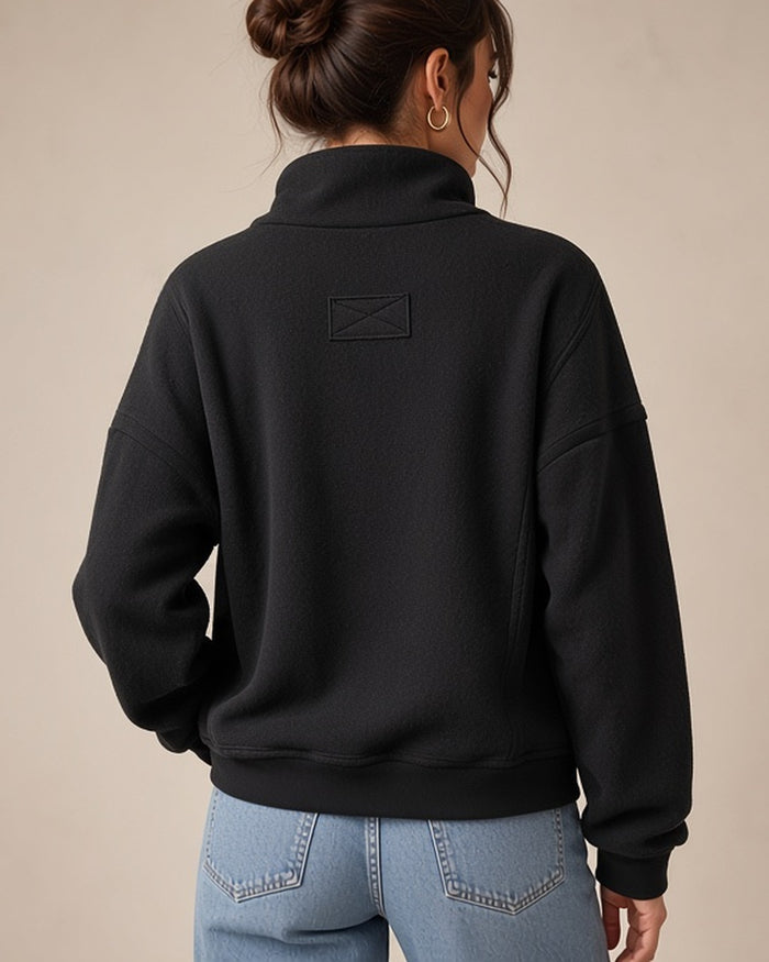 Model wearing black half-zip pullover - back